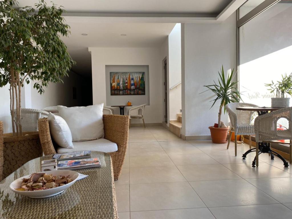 a living room with a couch and a table at Zest Exclusive Hotel & Spa in Ortakent