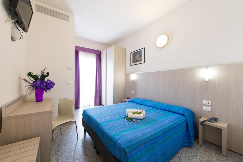 
Letto o letti in una camera di Hotel Villa Argia Rimini
