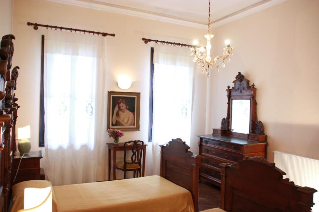 Postel nebo postele na pokoji v ubytování InChiostro Rooms&Breakfast