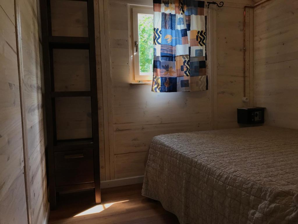 A bed or beds in a room at Càmping l'Alguer