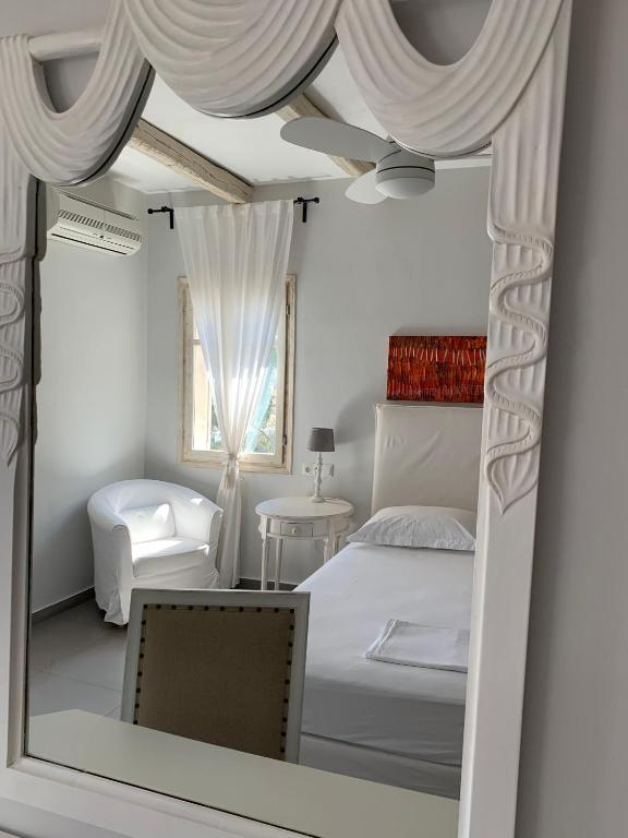 Postel nebo postele na pokoji v ubytování Speires suites