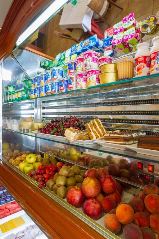a display case in a store filled with lots of food at Hotel Noguera El Albir in Albir