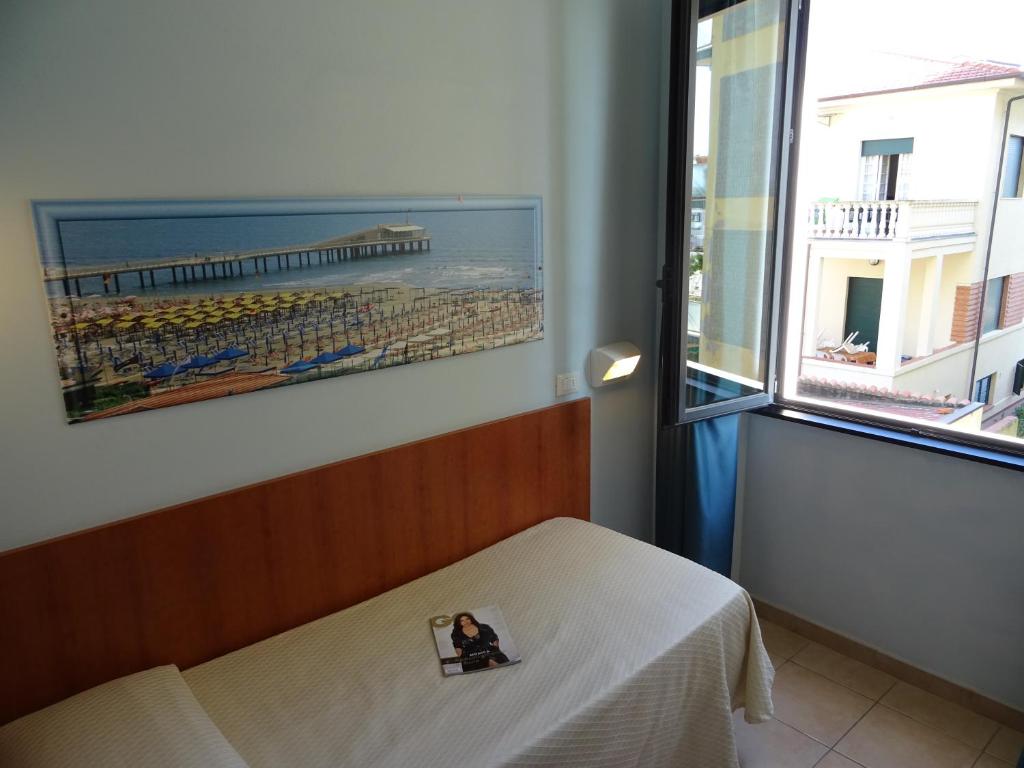 Łóżko lub łóżka w pokoju w obiekcie Hotel Sole E Mare