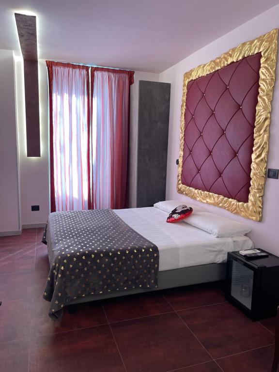 Postel nebo postele na pokoji v ubytování Hotel Relais Dei Papi