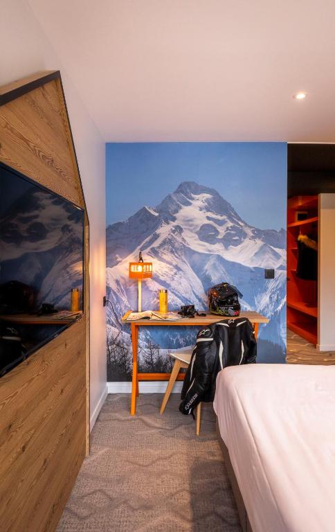 Postel nebo postele na pokoji v ubytování Hotel Base Camp Lodge - Les 2 Alpes