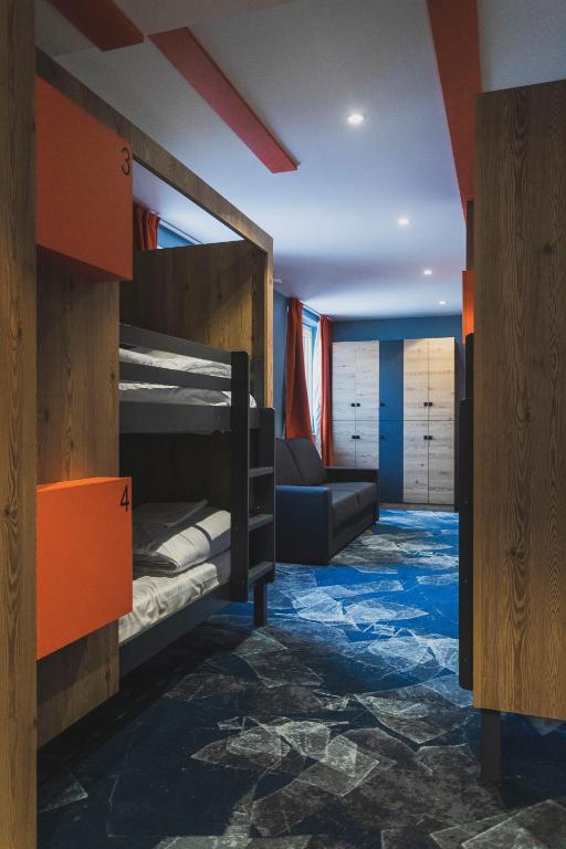 Postel nebo postele na pokoji v ubytování Hotel Base Camp Lodge - Les 2 Alpes