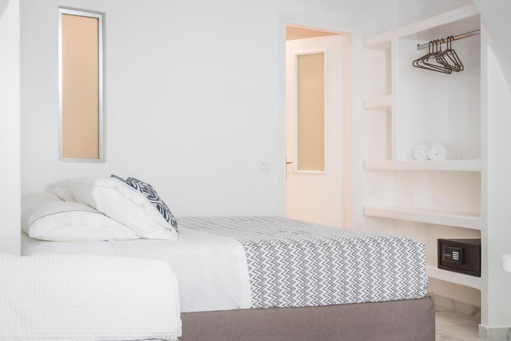 Postel nebo postele na pokoji v ubytování Kostantis Town Suites