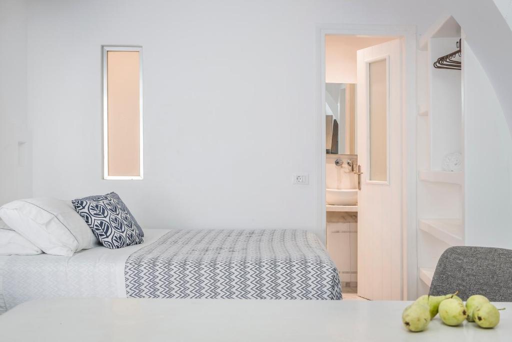Postel nebo postele na pokoji v ubytování Kostantis Town Suites