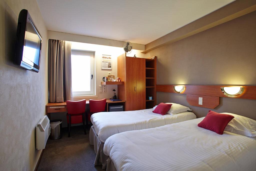 Postel nebo postele na pokoji v ubytování Vivaldi Hotel