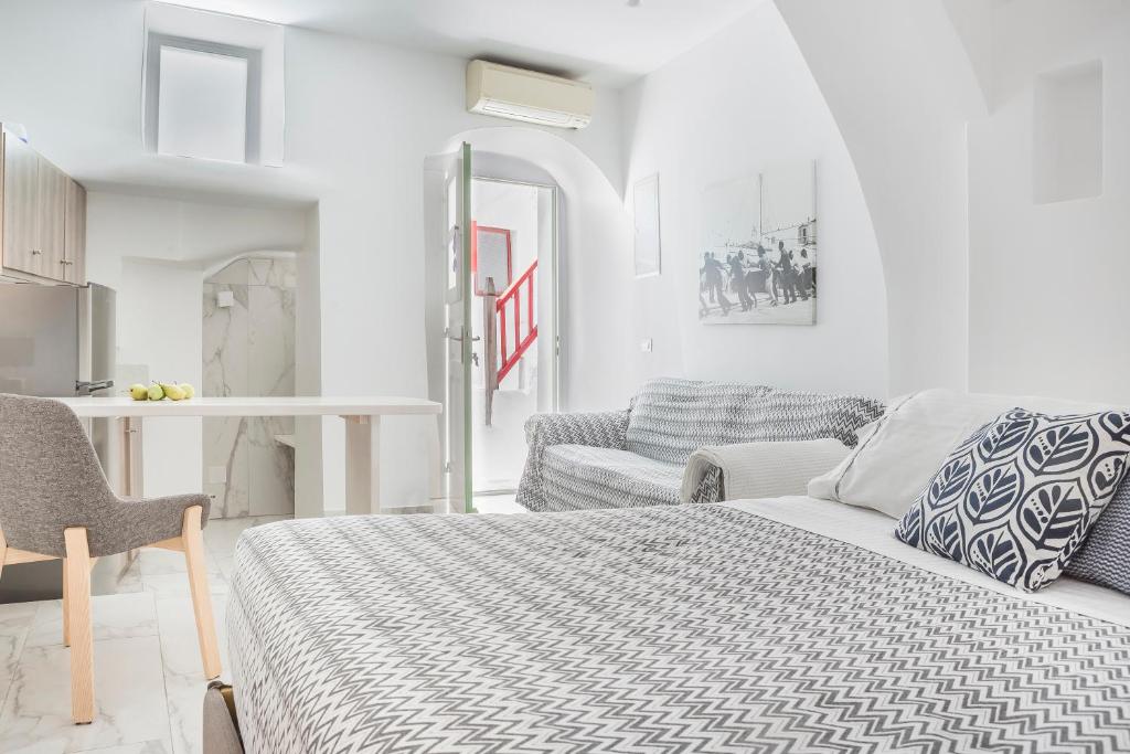 Postel nebo postele na pokoji v ubytování Kostantis Town Suites