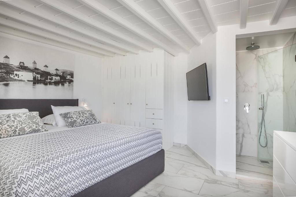 Postel nebo postele na pokoji v ubytování Kostantis Town Suites