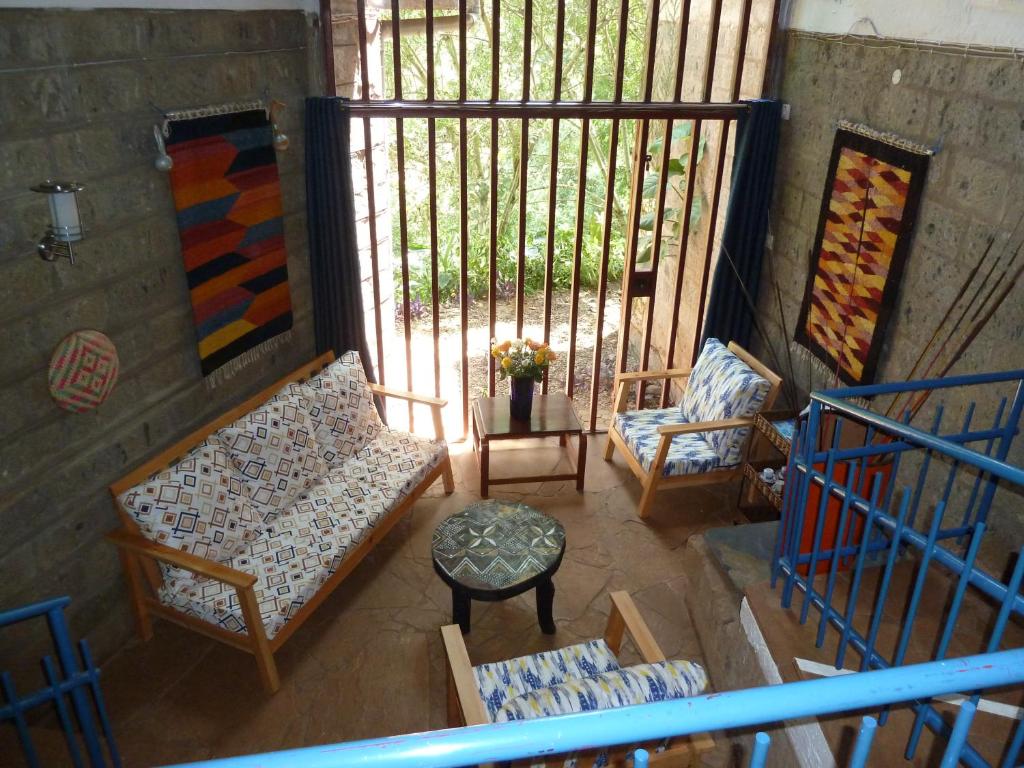 an overhead view of a room with chairs and a table at Villa Rock Stop Falls Gigiri in Nairobi
