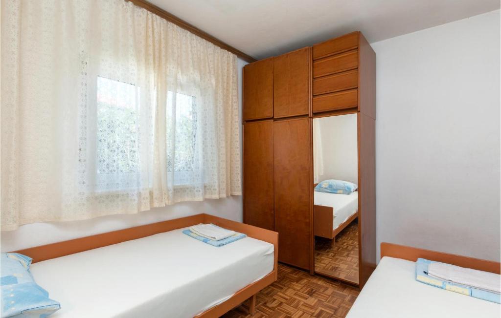 Postel nebo postele na pokoji v ubytování Two-Bedroom Holiday Home In Premantura