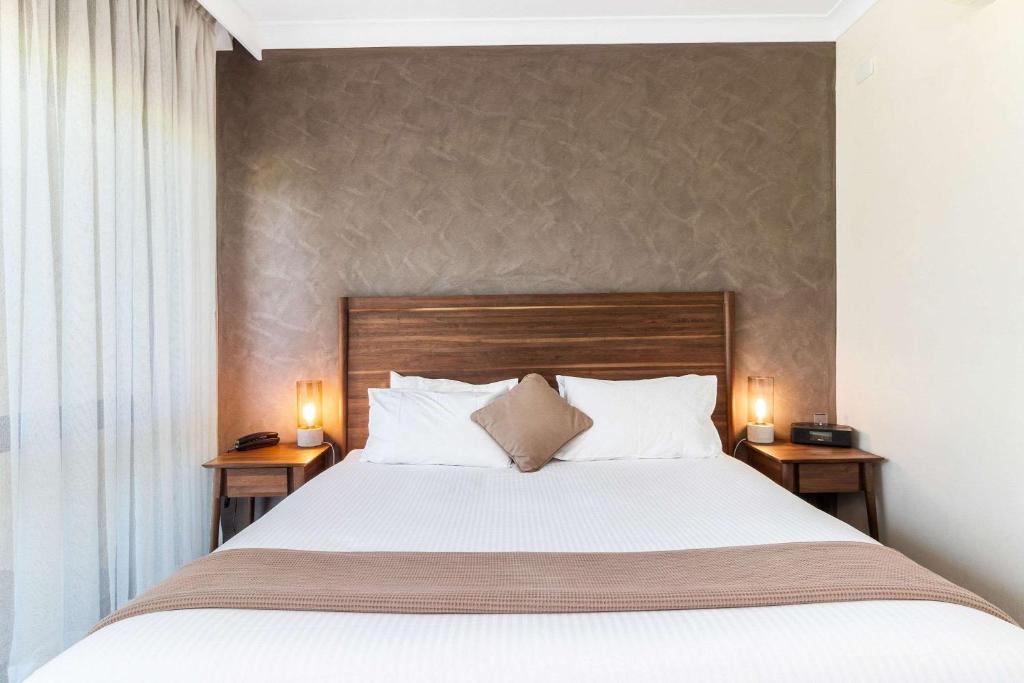 Postel nebo postele na pokoji v ubytování Quality Inn Dubbo International