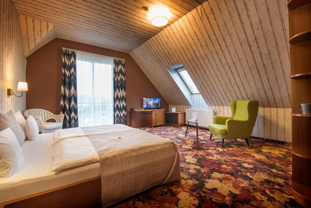 Posteľ alebo postele v izbe v ubytovaní Hotel Lajta Park