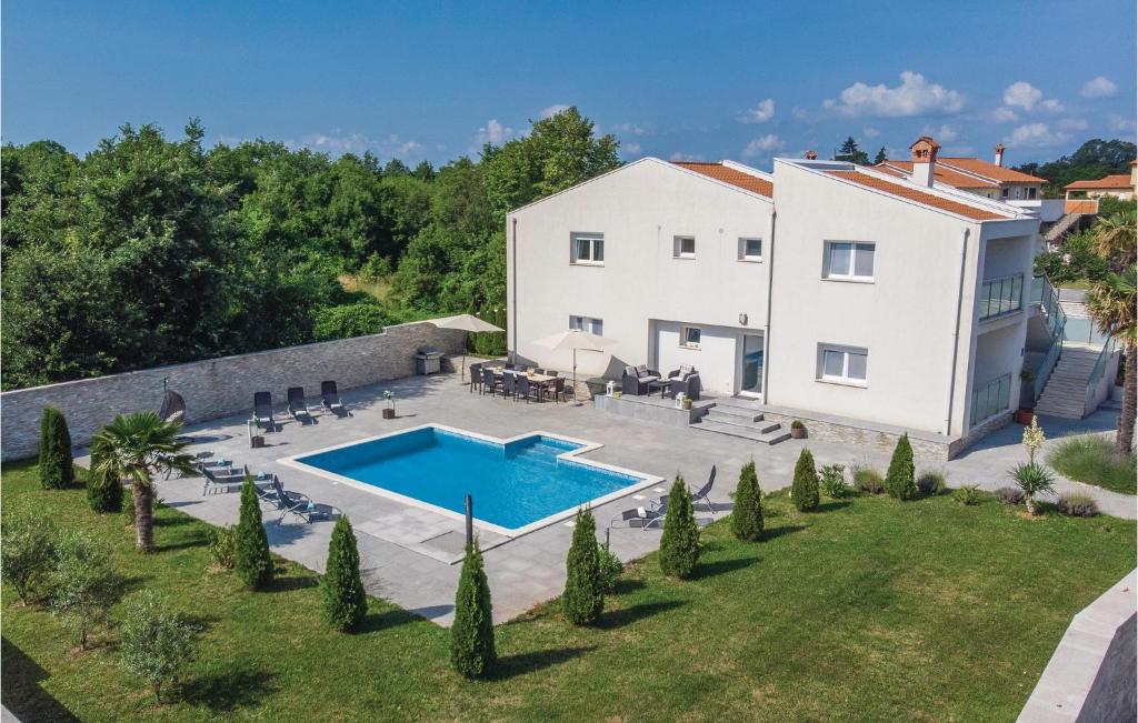 an aerial view of a house with a swimming pool at Stunning Home In Nedescina With Outdoor Swimming Pool in Nedeščina