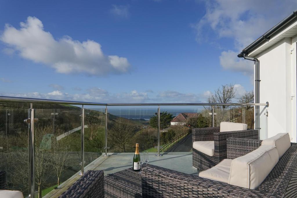a balcony with a view of the ocean at Hazelmere House in Woolacombe