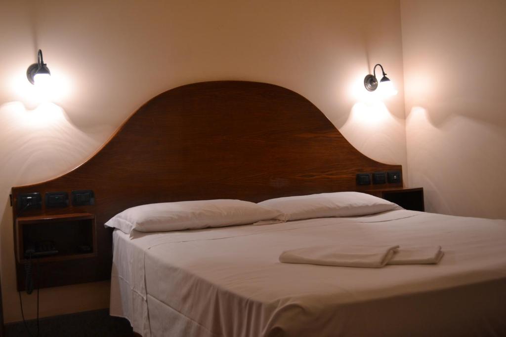 Postel nebo postele na pokoji v ubytování Hotel Al SanPietrino