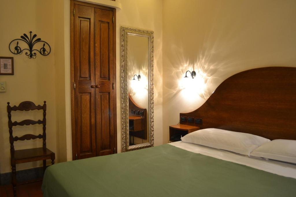 Postel nebo postele na pokoji v ubytování Hotel Al SanPietrino