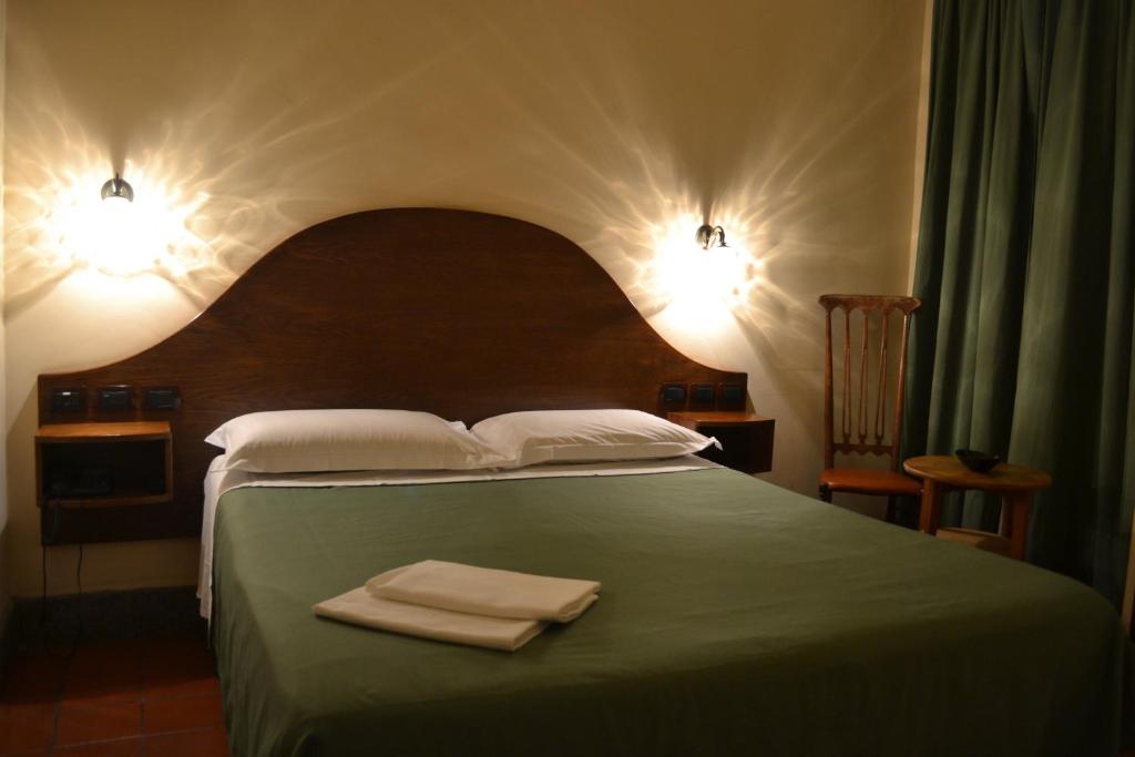 Postel nebo postele na pokoji v ubytování Hotel Al SanPietrino