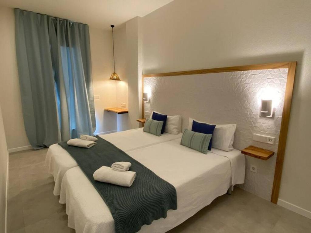 Ένα ή περισσότερα κρεβάτια σε δωμάτιο στο Apartamento Sa Mesquida 7