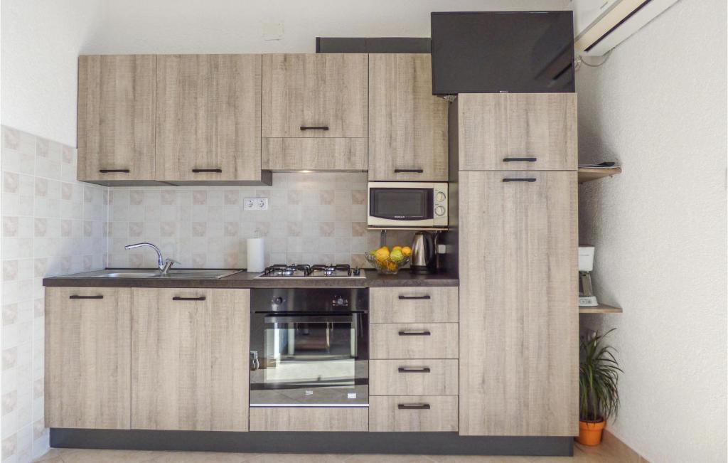 Kuchyň nebo kuchyňský kout v ubytování Apartment Mimice Mimice Brig Ii