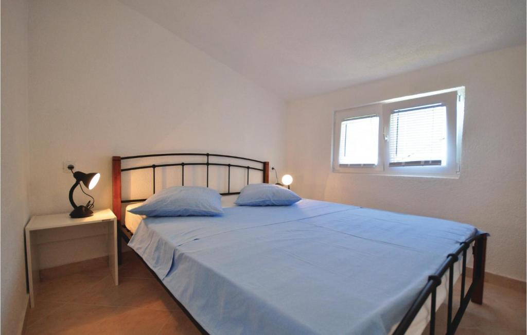 Postel nebo postele na pokoji v ubytování Apartment Mimice Mimice Brig Ii