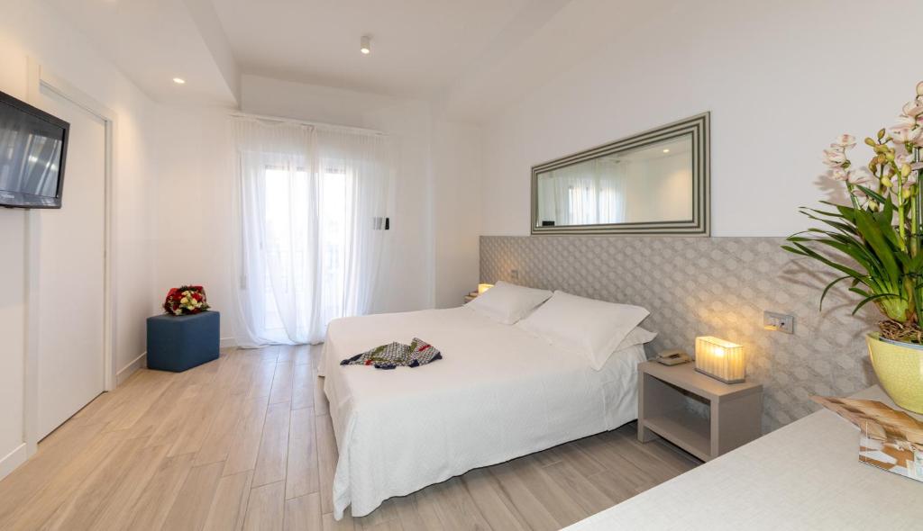 Postel nebo postele na pokoji v ubytování Hotel Nettuno