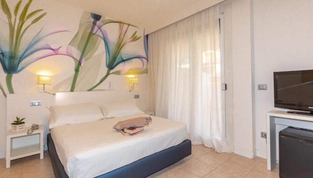 Postel nebo postele na pokoji v ubytování Hotel Nettuno