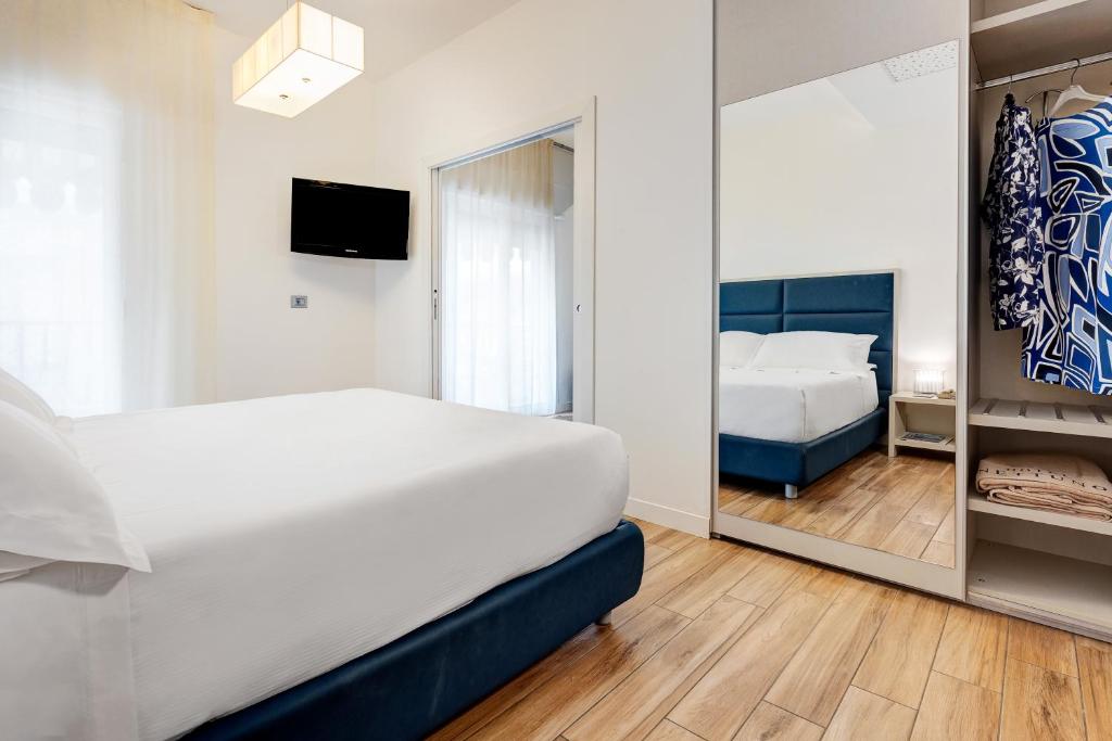 Postel nebo postele na pokoji v ubytování Hotel Nettuno