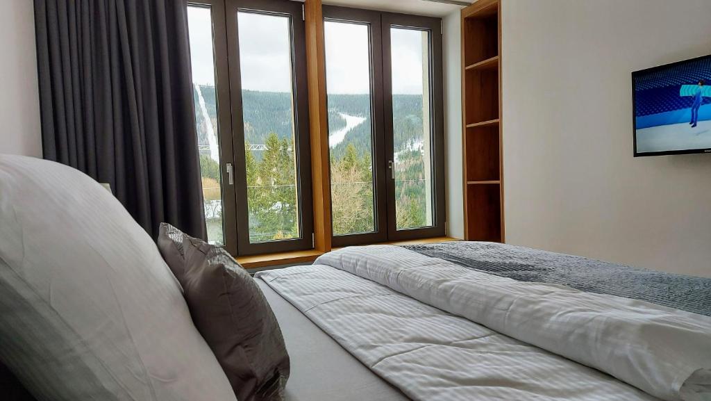 Postel nebo postele na pokoji v ubytování Apartments with mountain views