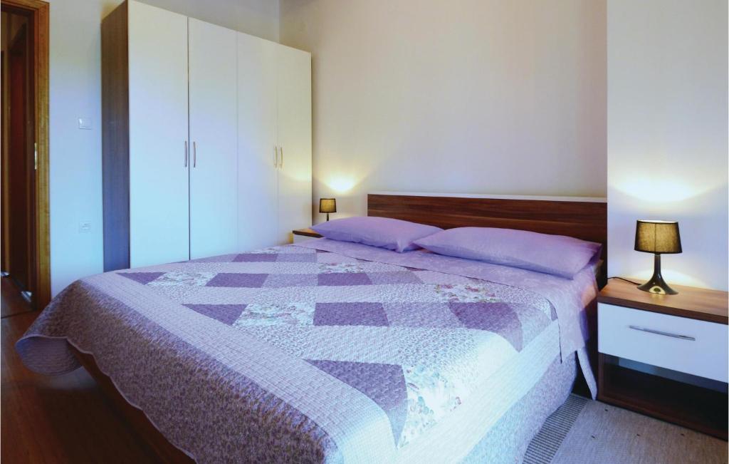 Postel nebo postele na pokoji v ubytování Holiday Home Jakacici Jakacici