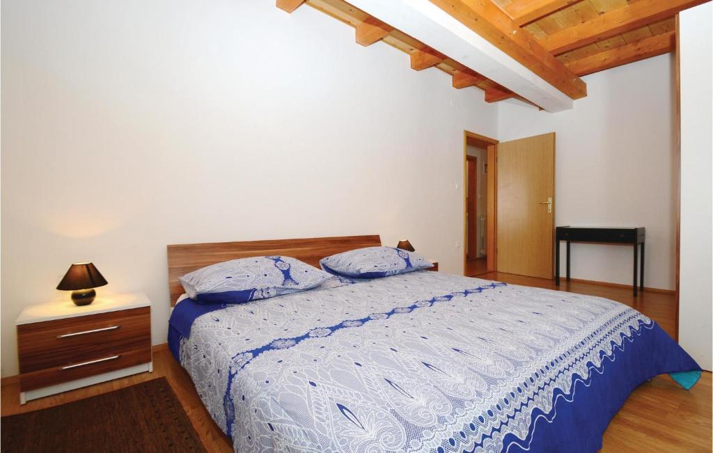 Postel nebo postele na pokoji v ubytování Holiday Home Jakacici Jakacici