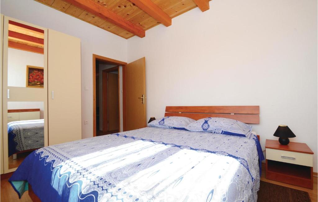 Postel nebo postele na pokoji v ubytování Holiday Home Jakacici Jakacici