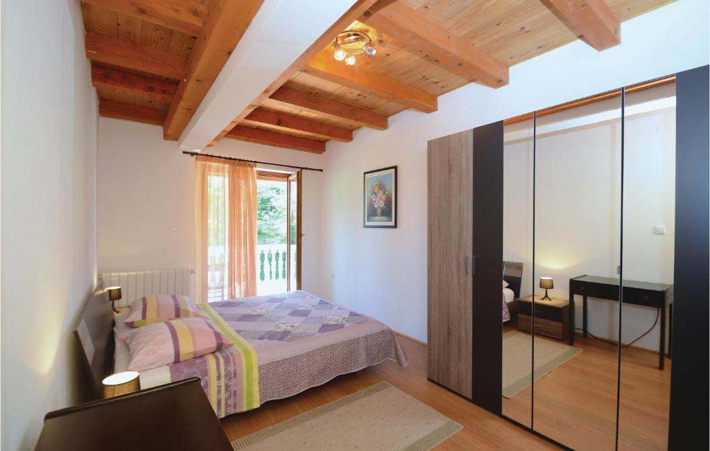 Postel nebo postele na pokoji v ubytování Holiday Home Jakacici Jakacici