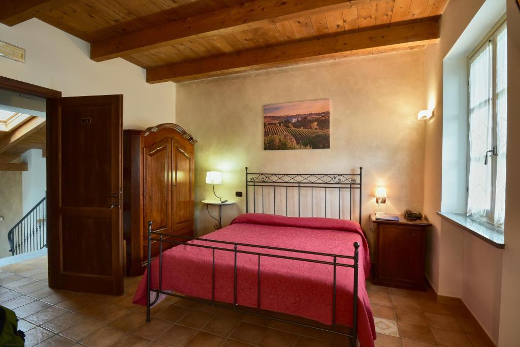 A bed or beds in a room at Agriturismo Podere La Piazza