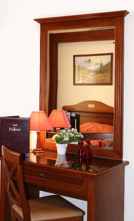 Postel nebo postele na pokoji v ubytování Hotel Pavone