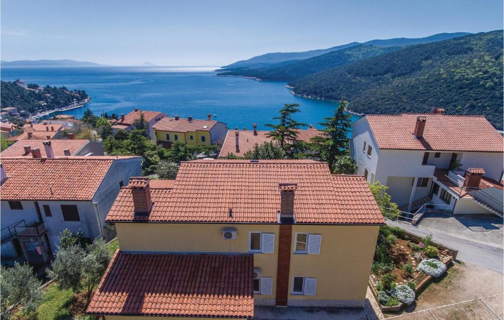 a view of a town with houses and a lake at Amazing Apartment In Rabac With Wifi in Raša