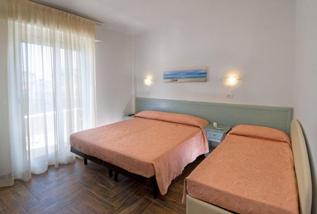 Postel nebo postele na pokoji v ubytování Hotel Belmar
