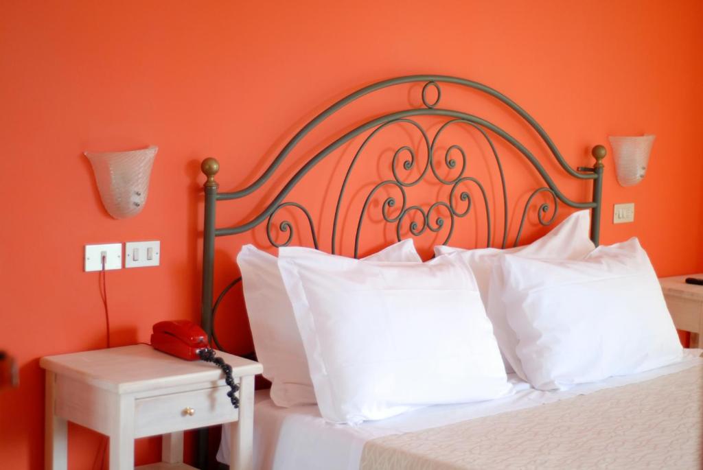 Postel nebo postele na pokoji v ubytování Hotel Benacus