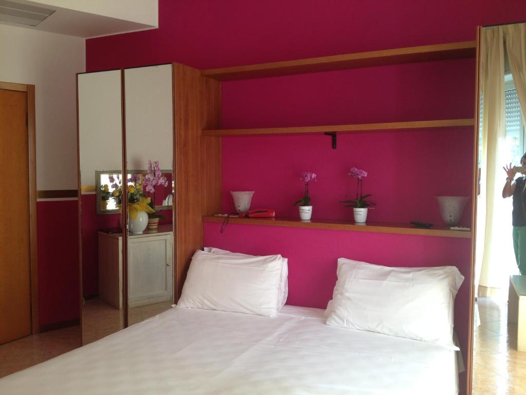 Postel nebo postele na pokoji v ubytování Hotel Benacus