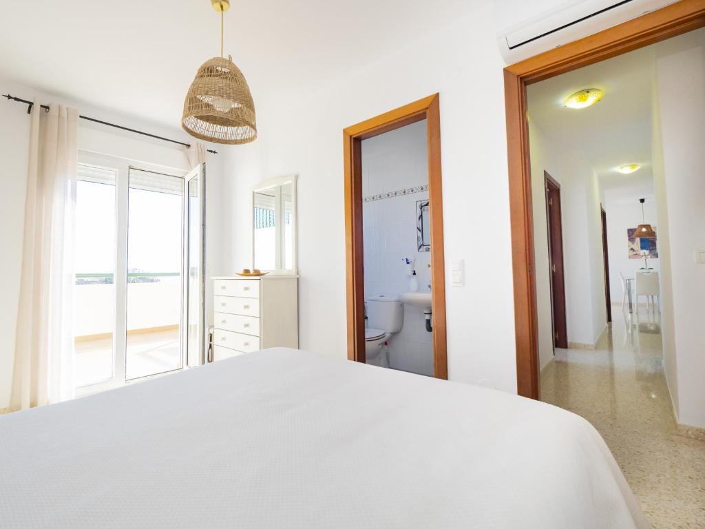 A bed or beds in a room at Cubo's La Terraza del Mar