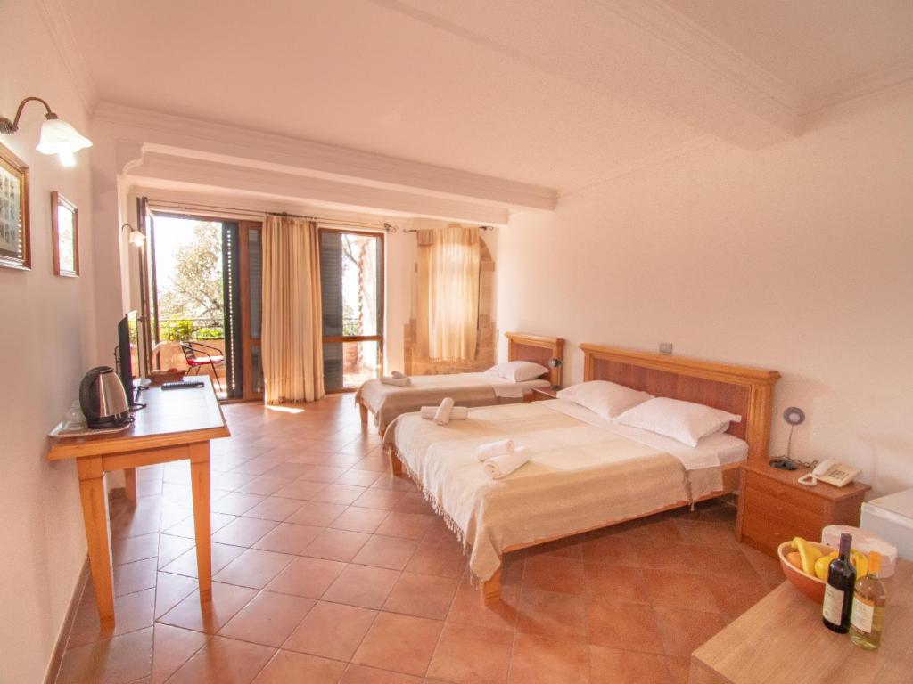 Postel nebo postele na pokoji v ubytování Apartments and Rooms Levantin Inn