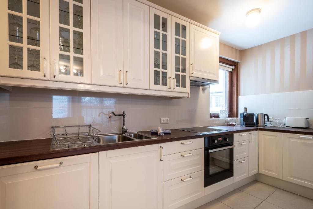 Kuchyň nebo kuchyňský kout v ubytování Bergzeit Appartments