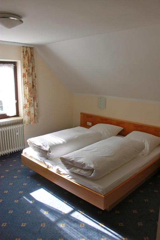 Postel nebo postele na pokoji v ubytování Arrivel am Bergson - bisher Hotel Neuner