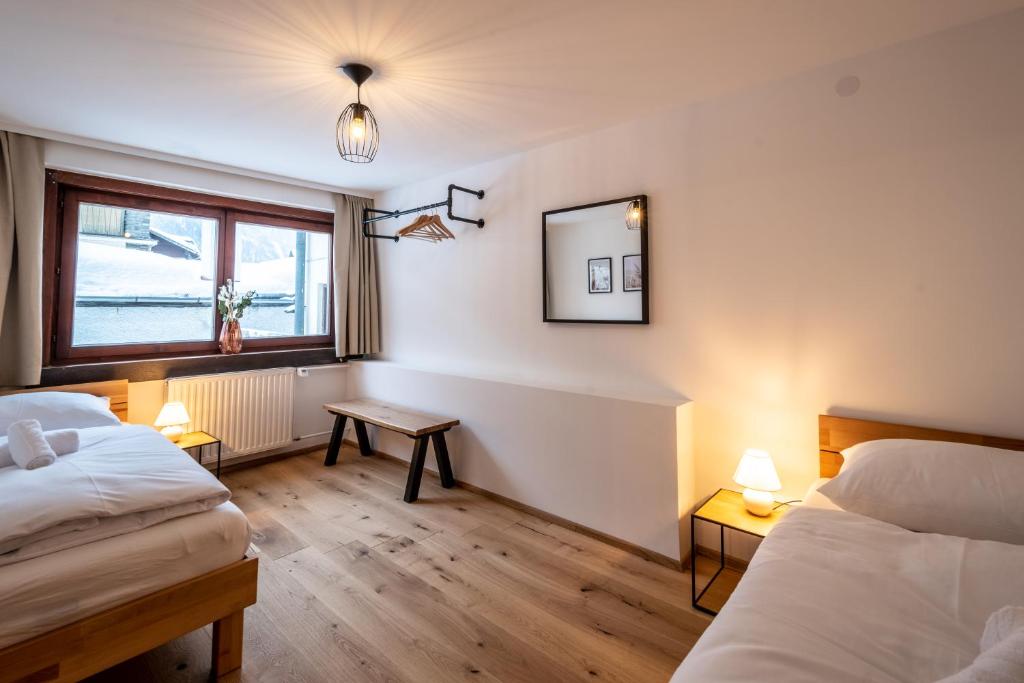 Postel nebo postele na pokoji v ubytování Bergzeit Appartments