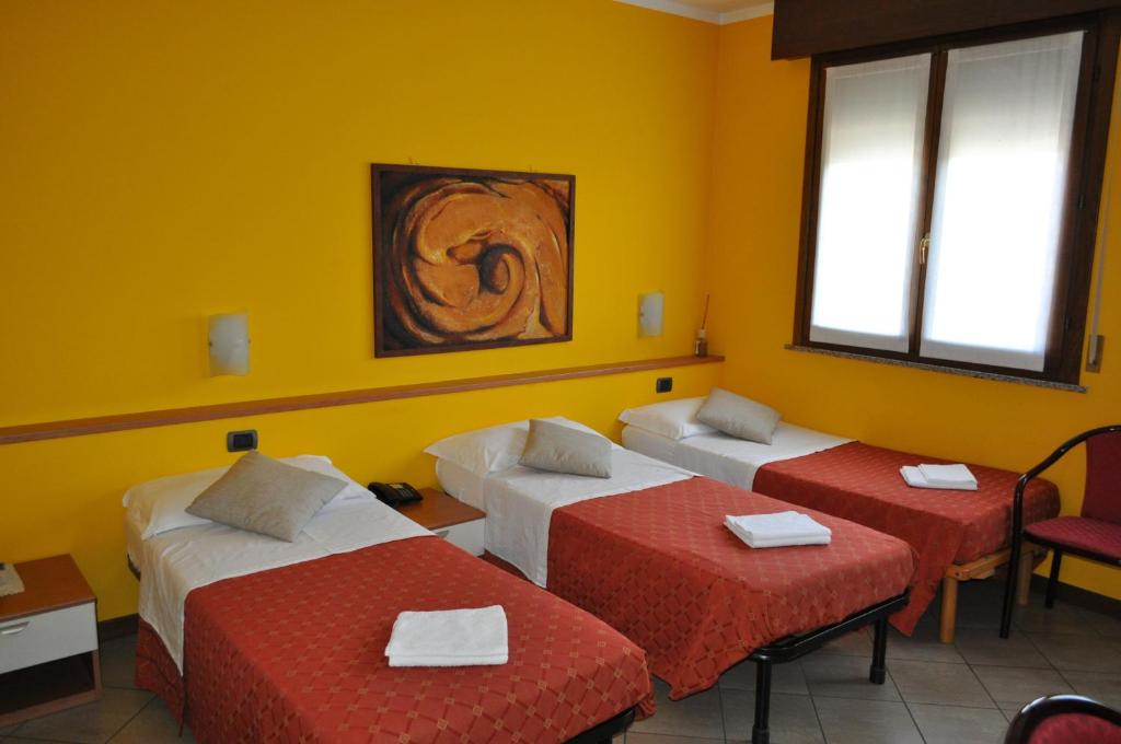 Postel nebo postele na pokoji v ubytování Hotel Mantova Sud