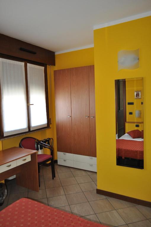 Postel nebo postele na pokoji v ubytování Hotel Mantova Sud