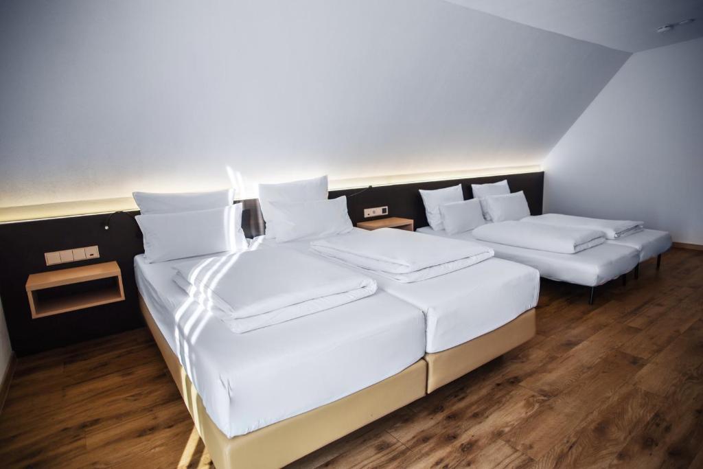 Postel nebo postele na pokoji v ubytování Hotel U7