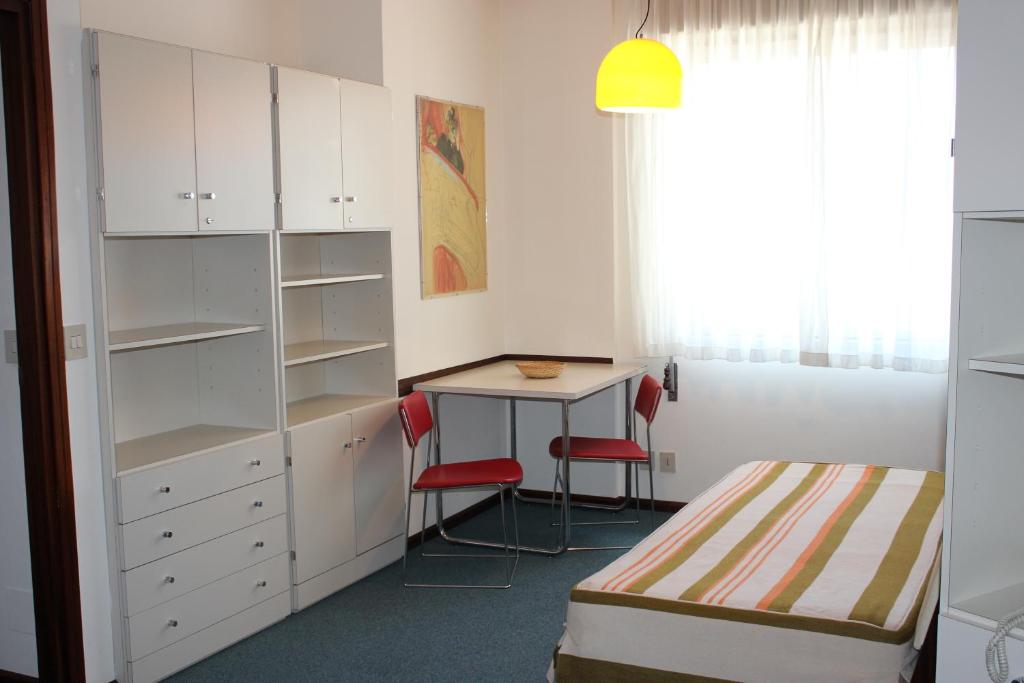 Postel nebo postele na pokoji v ubytování Albergo Residence Italia Vintage Hotel
